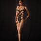 VORTEX – Black Strappy Cage & Floral Appliqué Bodysuit